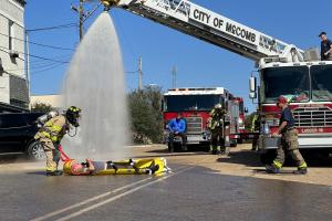 Gross decontamination of victims by fire department.